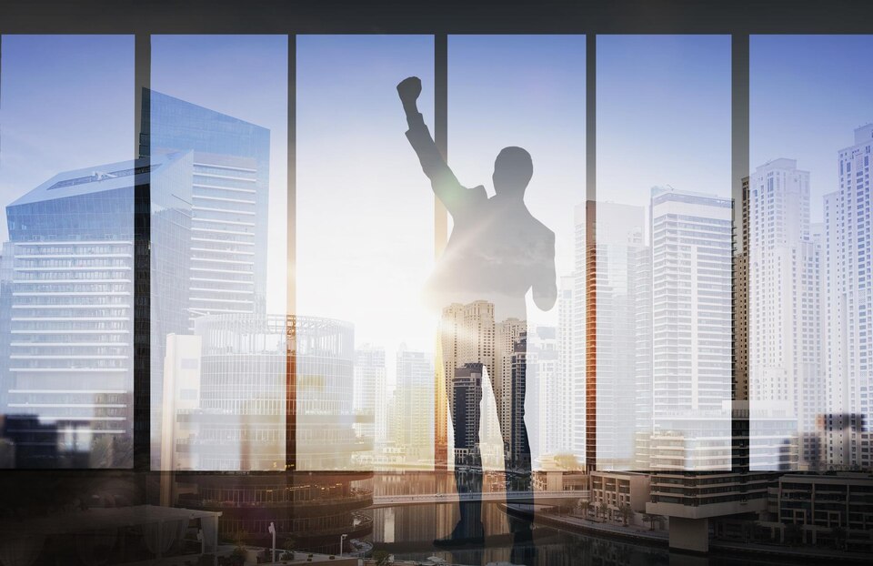 [freepicdownloader.com]-business-success-gesture-people-concept-silhouette-happy-businessman-raising-fist-celebrating-victory-double-exposure-office-city-background-large